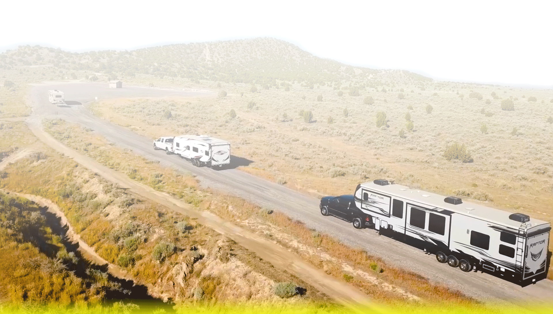 RVs towing along a desert road